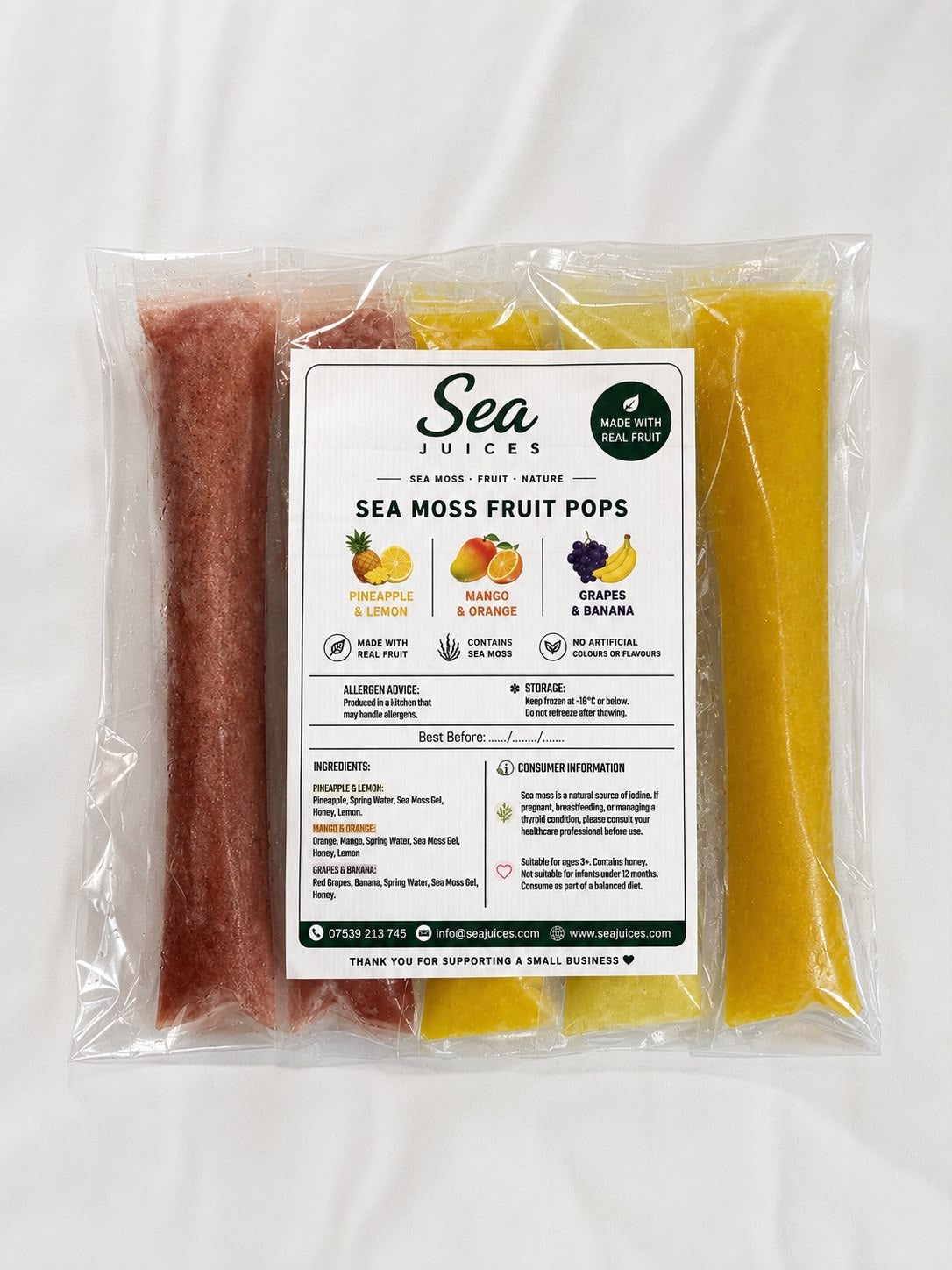 A clear plastic bag containing Sea Moss Fruit Pops by Sea Juices, with a white label in the center showing flavor icons and text. The pops are visible through the packaging as reddish-brown and yellow strips, set against a plain white background.